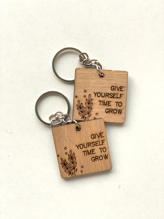 Give yourself time to grow keychain